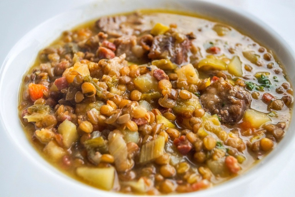 A bowl of hearty lentil soup with vegetables